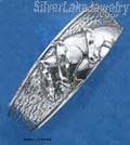Sterling Silver Three Horseheads Cuff Bracelet On Textured Background